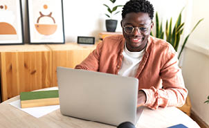 man on laptop at home